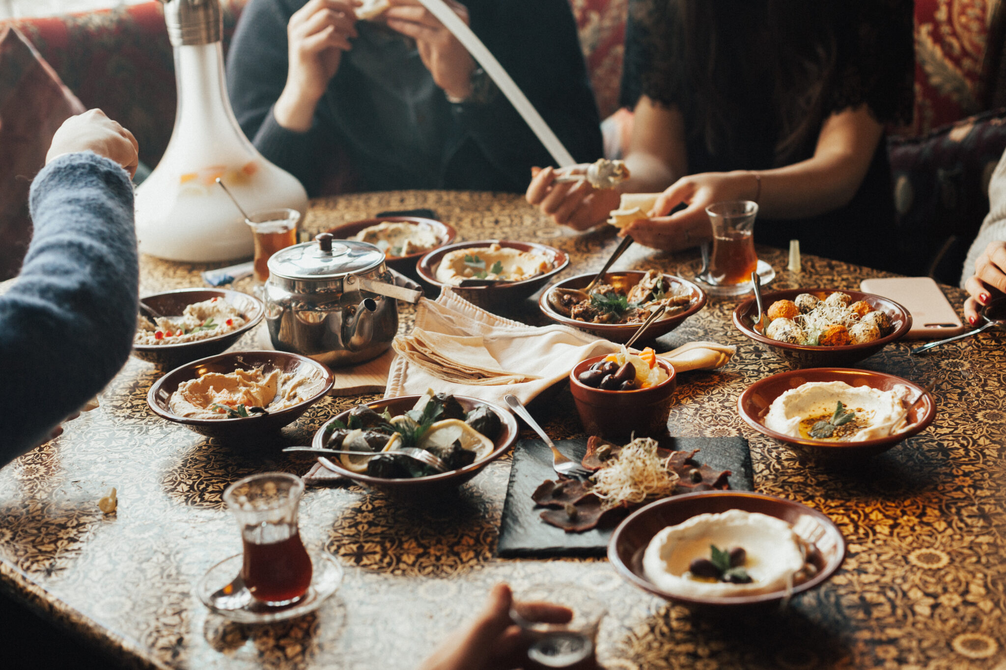 Lebanon cuisine served in restaurant. A young company of people