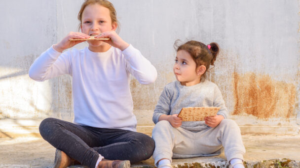 Two girls celebrating the Jewish holiday of Passover