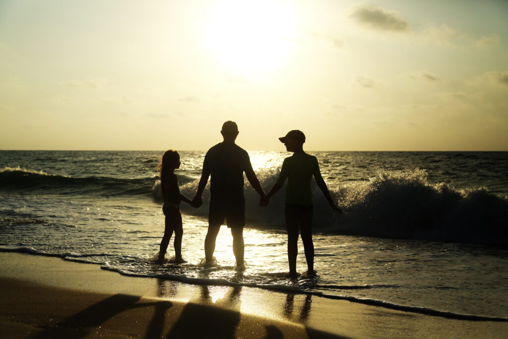 Father and his children in Israel at the beach
