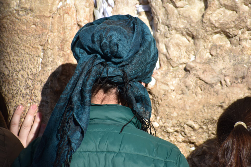 woman praying by the Western Wall