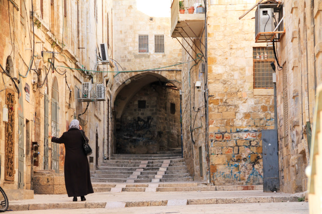 woman talking on her phone while walking in Israel