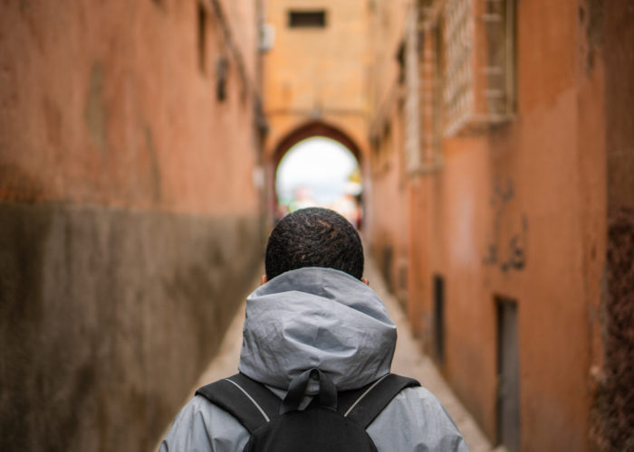 man standing in an ally