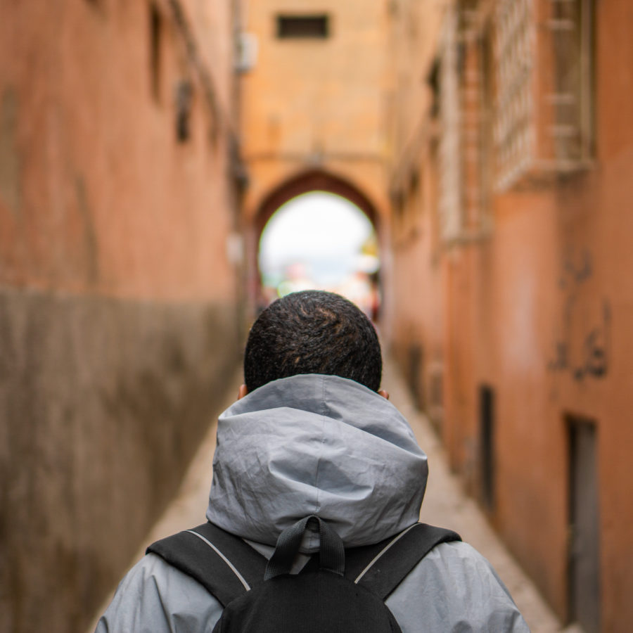 man standing in an ally