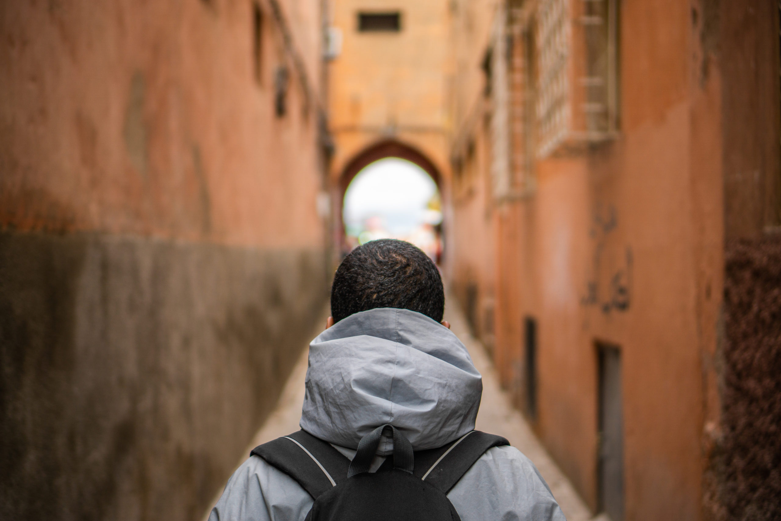 man standing in an ally