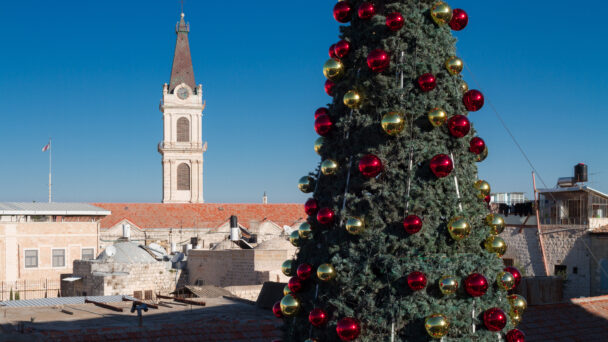 Christmas in Jerusalem, Israel. Christmas tree with color balls in Old City. View to Terra Sancta church