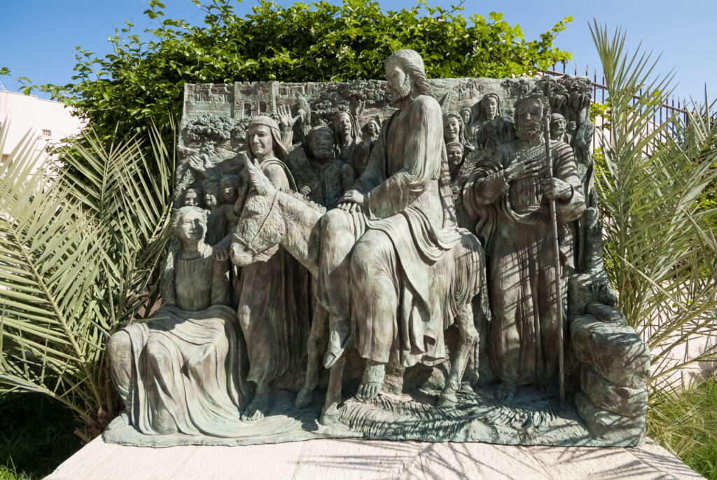 A statue of Jesus on a donkey on Palm Sunday