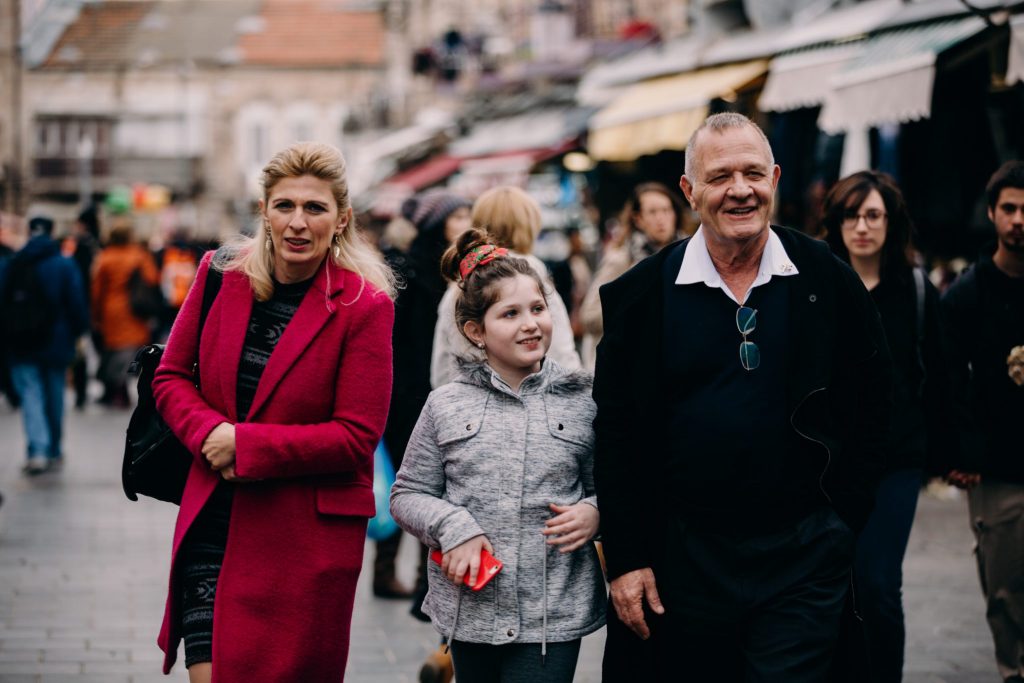 a family walking down the street in israel