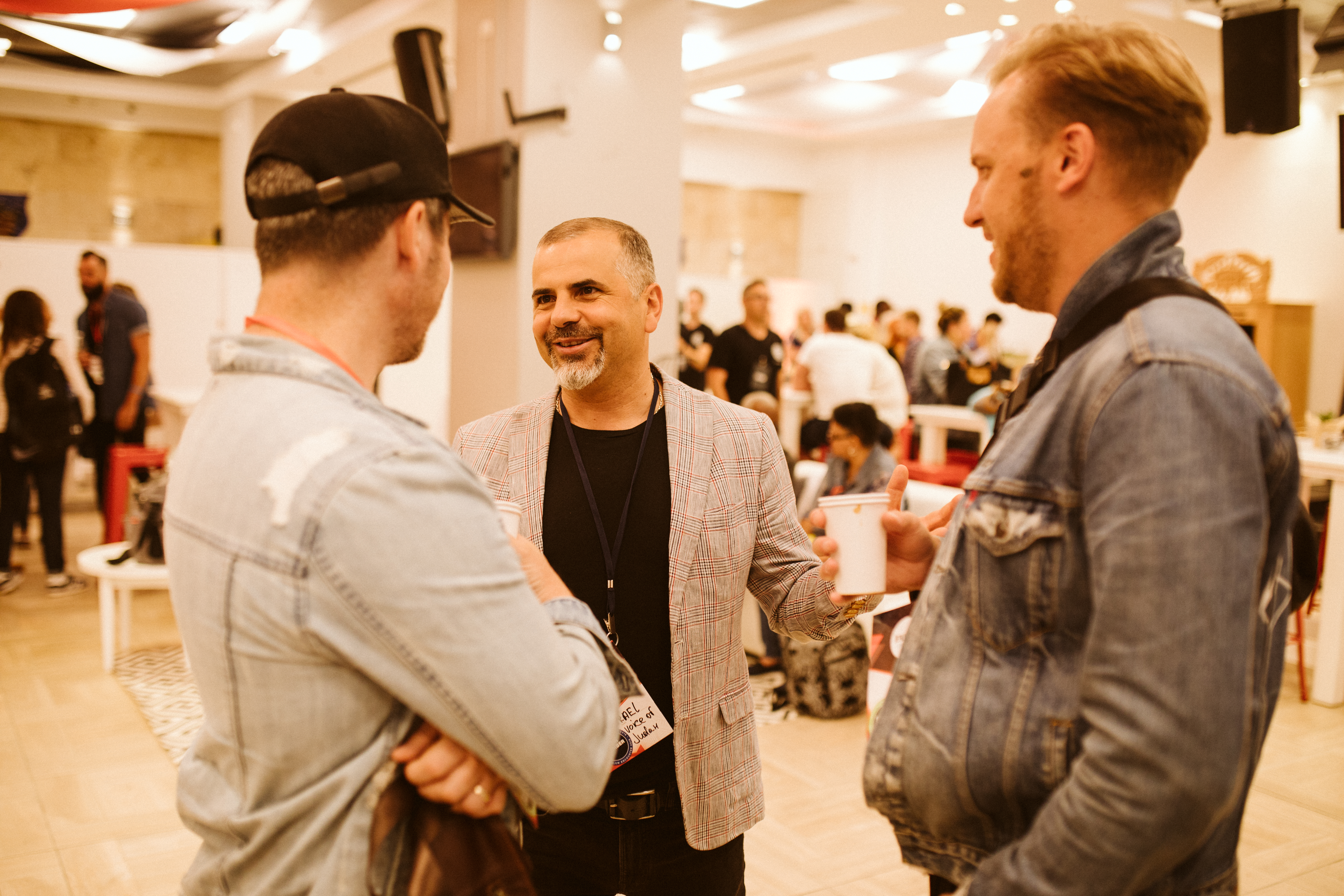 men talking at je conference