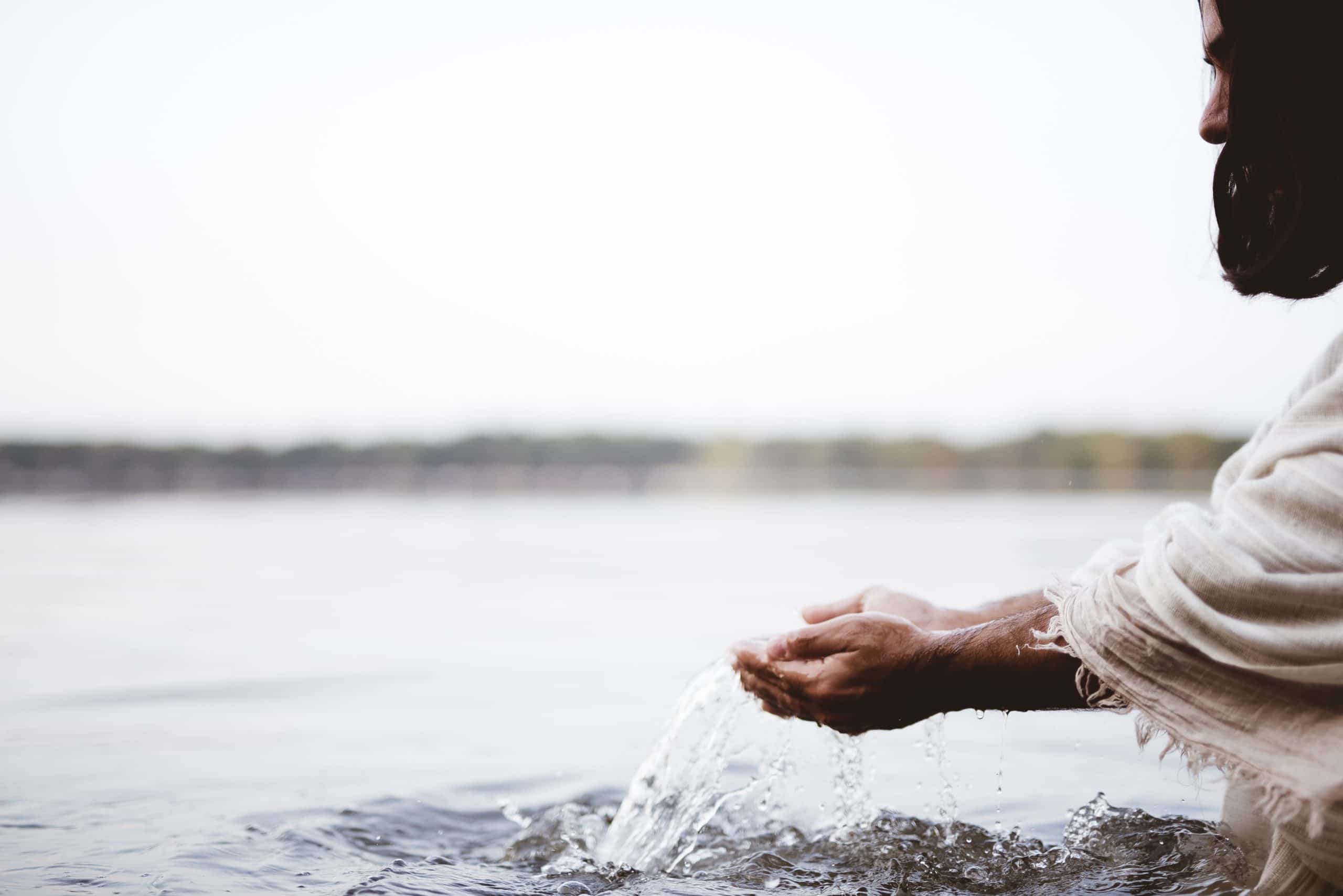Close up of Jesus washing His hands