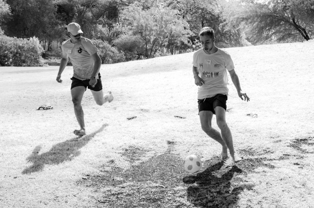 two boys playing soccer